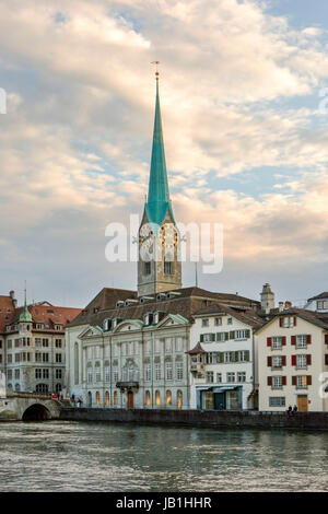 Zurich city center and Limmat quay in summer with city hall clock tower spire in summer Stock Photo