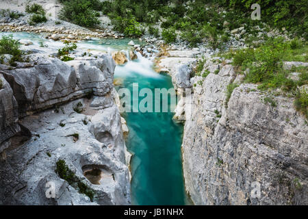 Aerial view of curved river and cliffs surrounding it Stock Photo