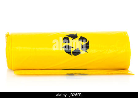 Rolls Of Yellow Trash Bags On White Background Stock Photo