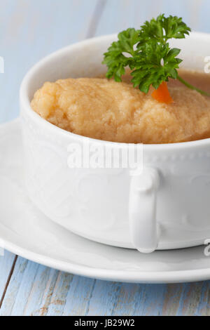 portion of bavarian griesnockerl soup Stock Photo