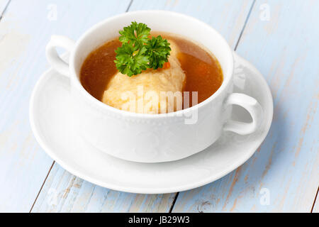 portion of bavarian griesnockerl soup Stock Photo