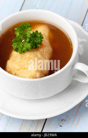 portion of bavarian griesnockerl soup Stock Photo
