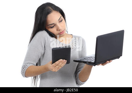 Arab business woman multi tasking busy with phone tablet and computer isolated on a white background Stock Photo