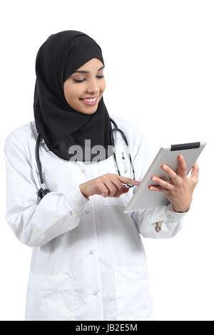 Saudi arab doctor woman working with a tablet isolated on a white background Stock Photo