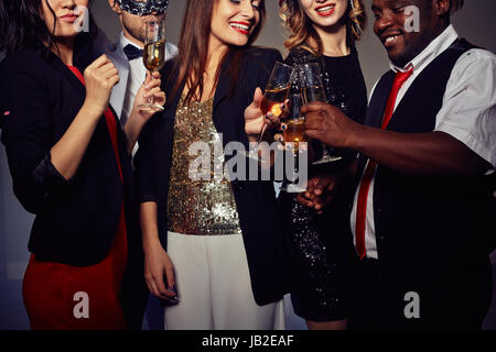 Toasting with Champagne Flutes Stock Photo
