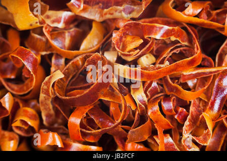 chips of cayenne chili red pepper pods close up Stock Photo