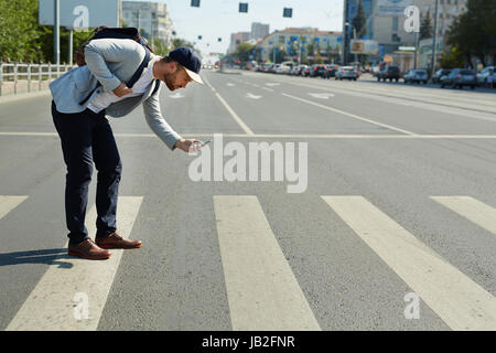 Man Focused on Augmented Reality Game Stock Photo