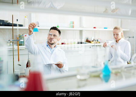 Team of Scientists Working in Chemical Laboratory Stock Photo