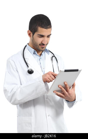 Arab saudi doctor man reading a tablet reader isolated on a white background Stock Photo
