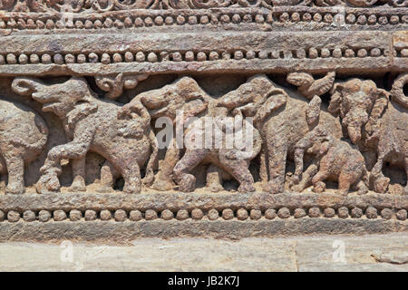 Carving of elephants around the base of the ancient Surya Hindu Temple at Konark in Orissa, India. 13th Century AD Stock Photo