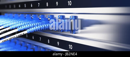 Close up of optical fiber optic telecommunication equipment and patchcords inside a network infrastructure. Blur effect with focus on one cable, blue tones. Stock Photo