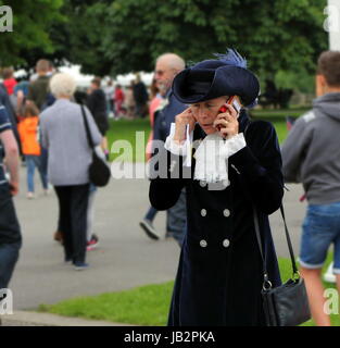 Beaulieu, Hampshire, UK - May 29 2017: High Sheriff of Hampshire the Hon Mrs Mary Montagu-Scott on her mobile phone at the 2017 999 Show Stock Photo