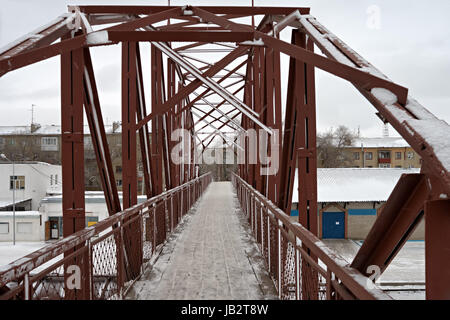 Construction of pedestrian iron bridge, view from above. Stock Photo