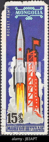 MONGOLIA - CIRCA 1963: A postage stamp printed in the Mongolia shows launch of carrier rocket Vostok L, circa 1963 Stock Photo