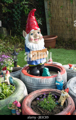 Garden gnome with welcome sign, Overton, Hampshire, England, United Kingdom Stock Photo