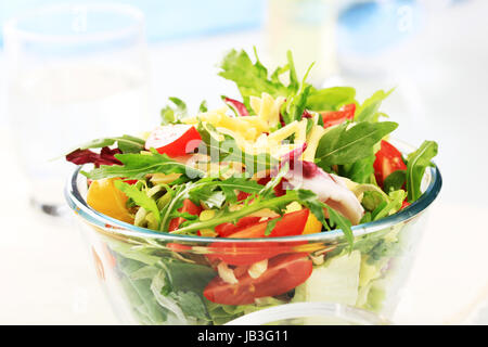 Fresh vegetable salad sprinkled with grated cheese Stock Photo