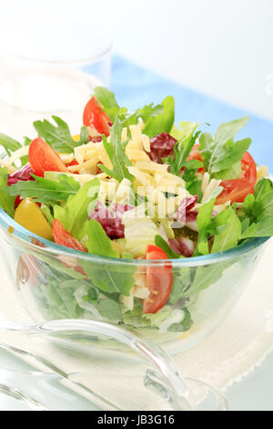 Vegetable salad sprinkled with grated cheese - detail Stock Photo