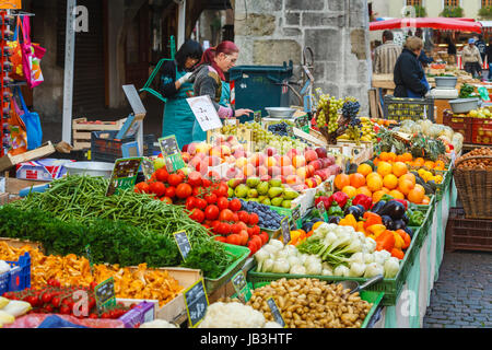 French lifestyle: Colourful fresh fruit and vegetables piled up displayed for sale on a stall at a local vegetable market, old town in Annecy, France Stock Photo