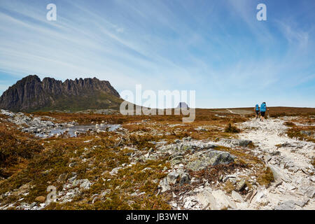 Windswept hikers on the desolate Overland Trail, Tasmania Stock Photo