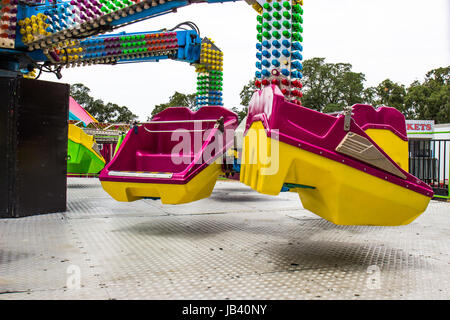 Two Burgundy Buckets On Local County Fair Ride Stock Photo