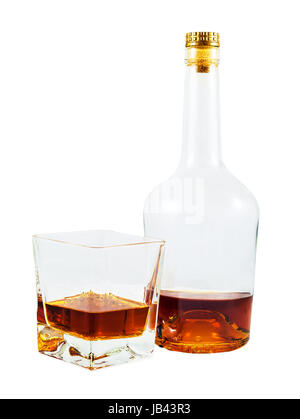 Almost empty bottle and glass of whiskey isolated on white background with clipping path Stock Photo
