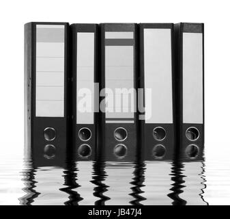 partly sunken folders on reflective water surface Stock Photo
