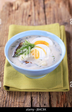 Sour cream dill soup with mushrooms and boiled egg Stock Photo