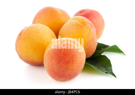 Sweet peaches with leafs on a white background Stock Photo