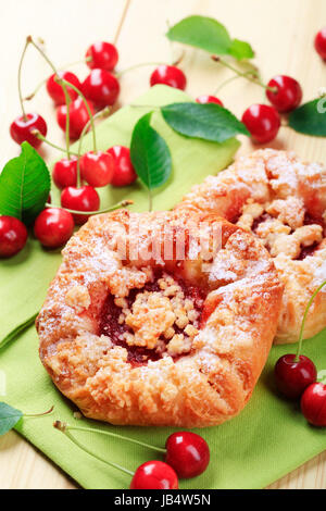 Danish pastry with fresh cherries - closeup Stock Photo