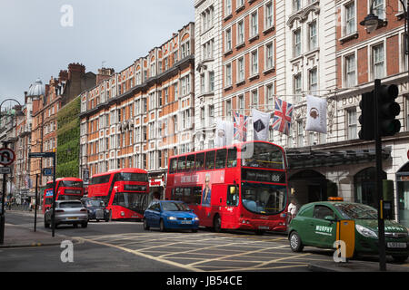 LONDON/UK - MAY 20 : Red double deckers and typical cabs in Russell square, London. Stock Photo