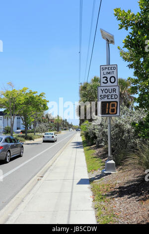 SIESTA KEY, FLORIDA - MAY 9, 2013: Your Speed, vehicle speed detector sign showing current speed of car that just passed and posted regular speed limit on top just outside Siesta Beach on a sunny day. Stock Photo