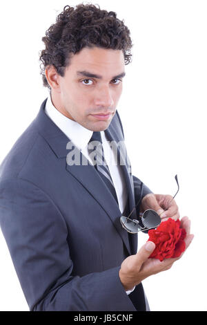 seducer in suit with sunglasess holding rose Stock Photo