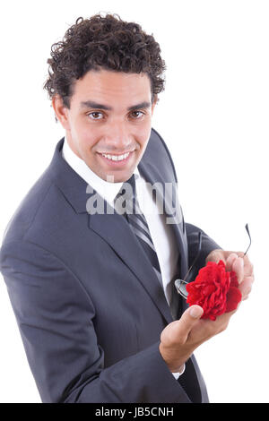 seducer in suit and sunglasess smiling  with rose Stock Photo