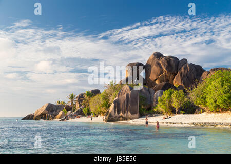 Beautifully shaped granite boulders in illuminated by summer sun on picture perfect tropical Anse Source d'Argent beach, La Digue island, Seychelles. Stock Photo