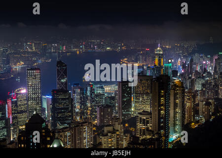 Aerial night view from Victoria peak to Kowloon bay and skyscrapers of Hong Kong island, China republic Stock Photo