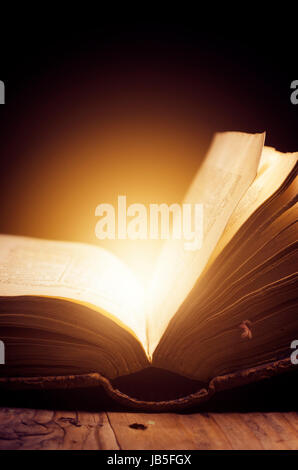 Open book with magic light Stock Photo