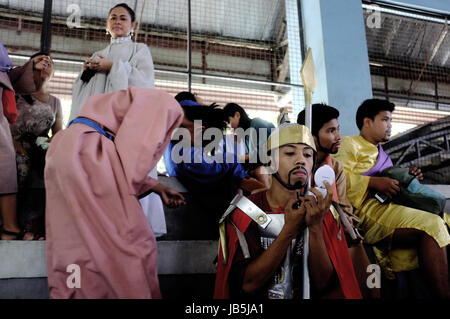 Cebu City, the Philippines - April 3, 2015. Locals prepare for the annual parade at the easter celebrations in Cebu City. Stock Photo