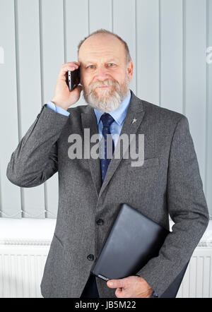 Picture of a thoughtful businessman having a phone call Stock Photo