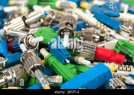 closeup of various types of fiber optic connectors Stock Photo