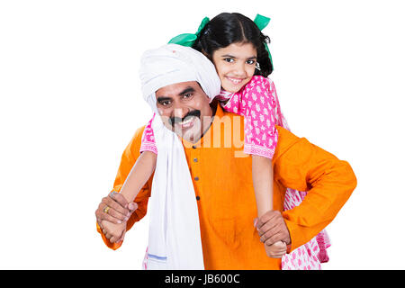 Indian Rural Farmer Father giving her daughter a piggy back ride On White Background Stock Photo