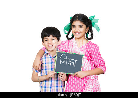 2 Indian Rural Kids Girl And Boy Student in showing a writing slate Board On White Background Education Concept. Stock Photo