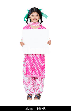Happy 1 Indian Rural Kid Girl Showing White Board In Studio shot on White Background Stock Photo
