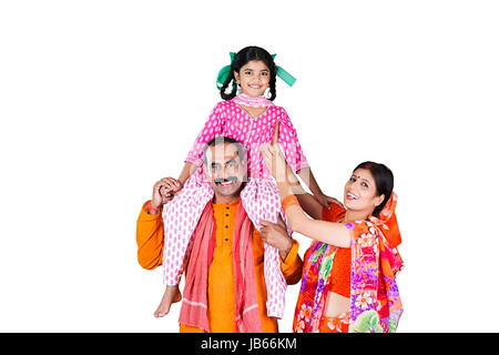 Indian Rural Farmer Family-Father carrying Little Daughter on His shoulders With Mother Happy Enjoying Stock Photo