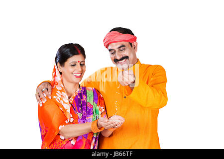 2 Indian Rural farmer Couple Holding wheat in his hand Falling Wheat Purity Quality Stock Photo