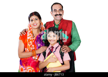 Indian Rural Parents And Kid Daughter Standing Together. School Education Together Stock Photo
