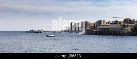 Rocky coast in Bugibba tourist city, Malta, Europe. Stock Photo