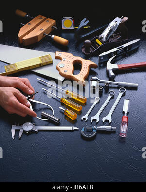 Hand Tools With a Pair of Hands Stock Photo
