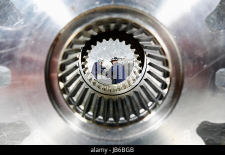 MODEL RELEASED. Engineers working on site, view through cog. Stock Photo
