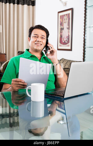 1 Person Only Adult Man At Home Bill Businessman Checking Laptop Mobile Phone Paper Talking Stock Photo
