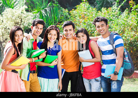 Happy Group Indian College Friends Students Standing In Park Enjoying Stock Photo